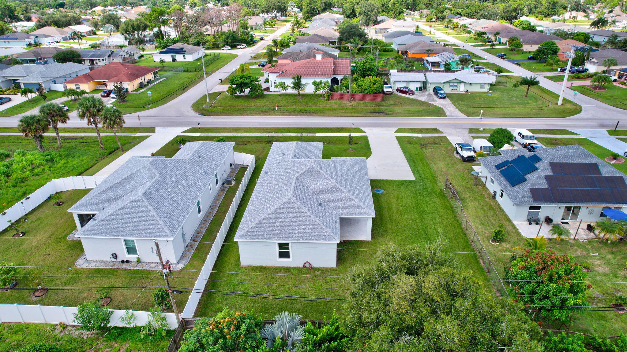 1749 Southwest California Boulevard Port St. Lucie, FL 34953 - Photo 29 of 33 an aerial view of residential houses with outdoor space and a swimming pool