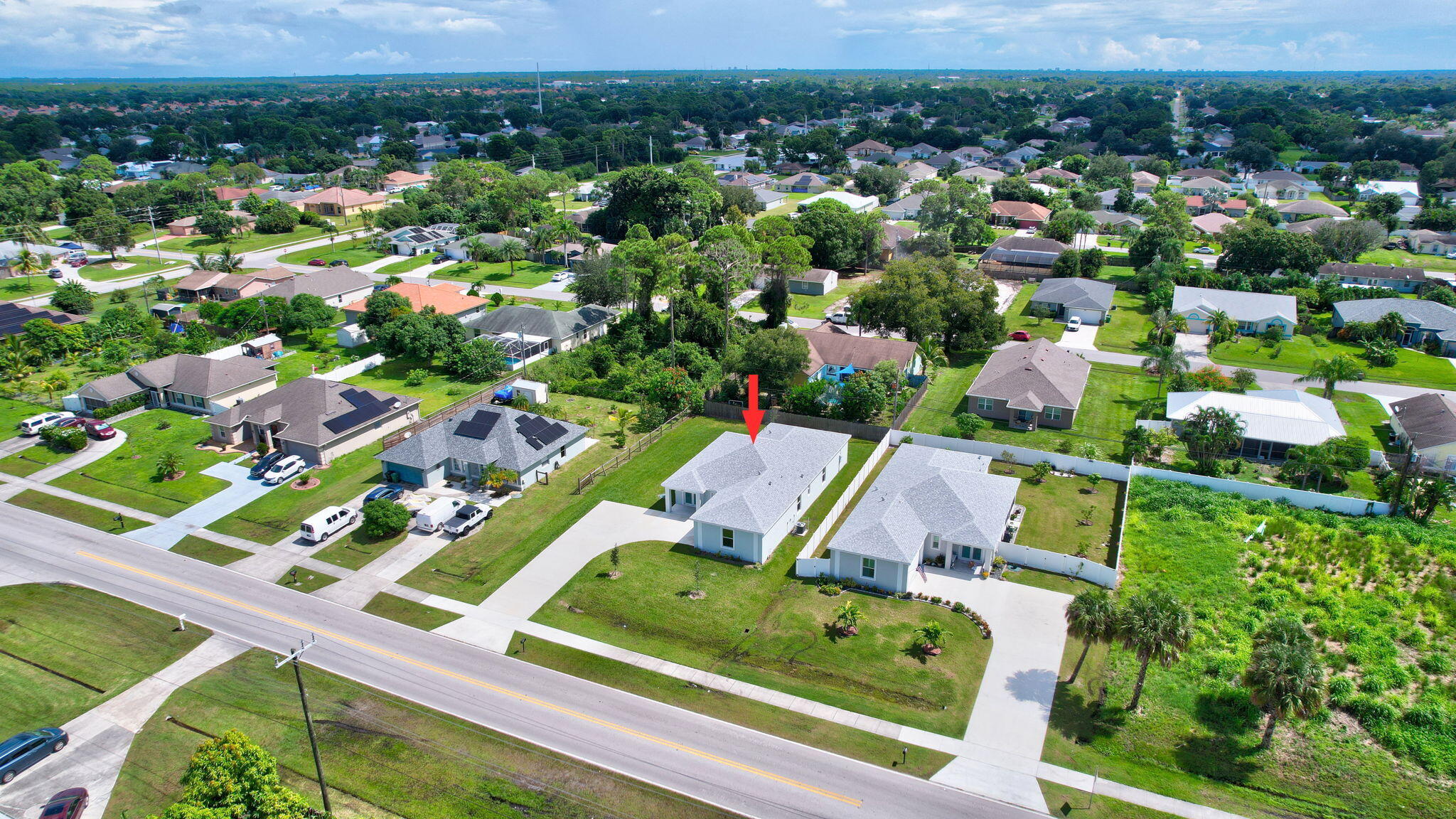 1749 Southwest California Boulevard Port St. Lucie, FL 34953 - Photo 31 of 33 an aerial view of residential houses with outdoor space and parking