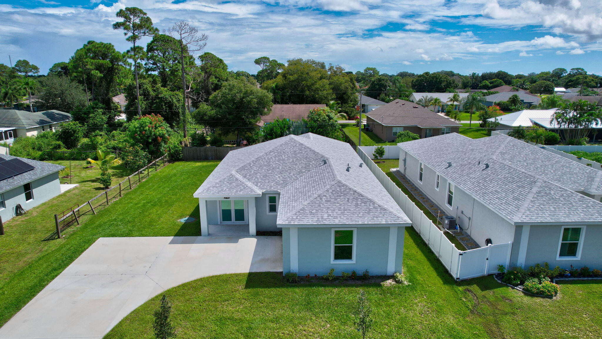 1749 Southwest California Boulevard Port St. Lucie, FL 34953 - Photo 32 of 33 an aerial view of a house with a garden