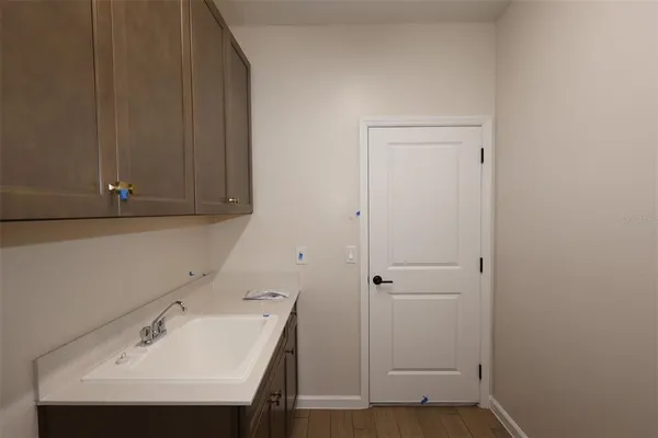 a bathroom with a sink and a window