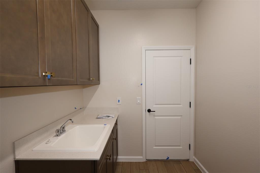 5303 High Line Drive St. Cloud, FL 34771 - Photo 12 of 22 a bathroom with a sink and a window