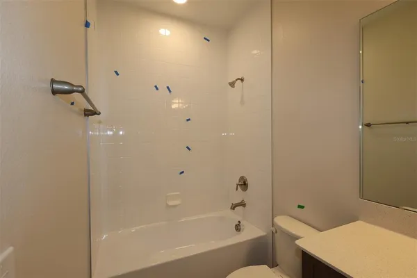 a bathroom with a bathtub and shower