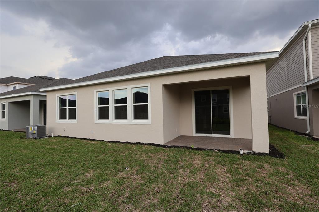 5303 High Line Drive St. Cloud, FL 34771 - Photo 19 of 22 a front view of house with yard