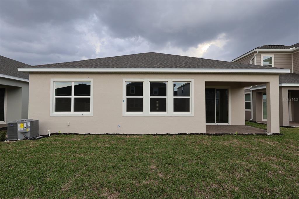 5303 High Line Drive St. Cloud, FL 34771 - Photo 20 of 22 a front view of house with yard
