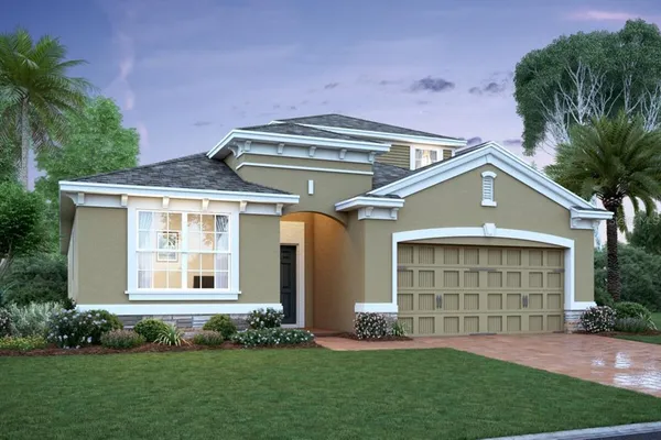 a front view of a house with a garden and plants