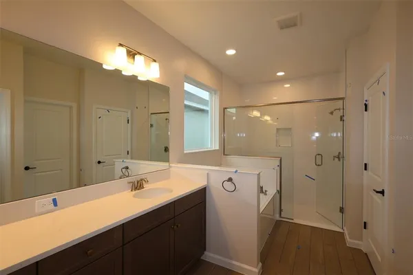 a bathroom with a double vanity sink mirror and double