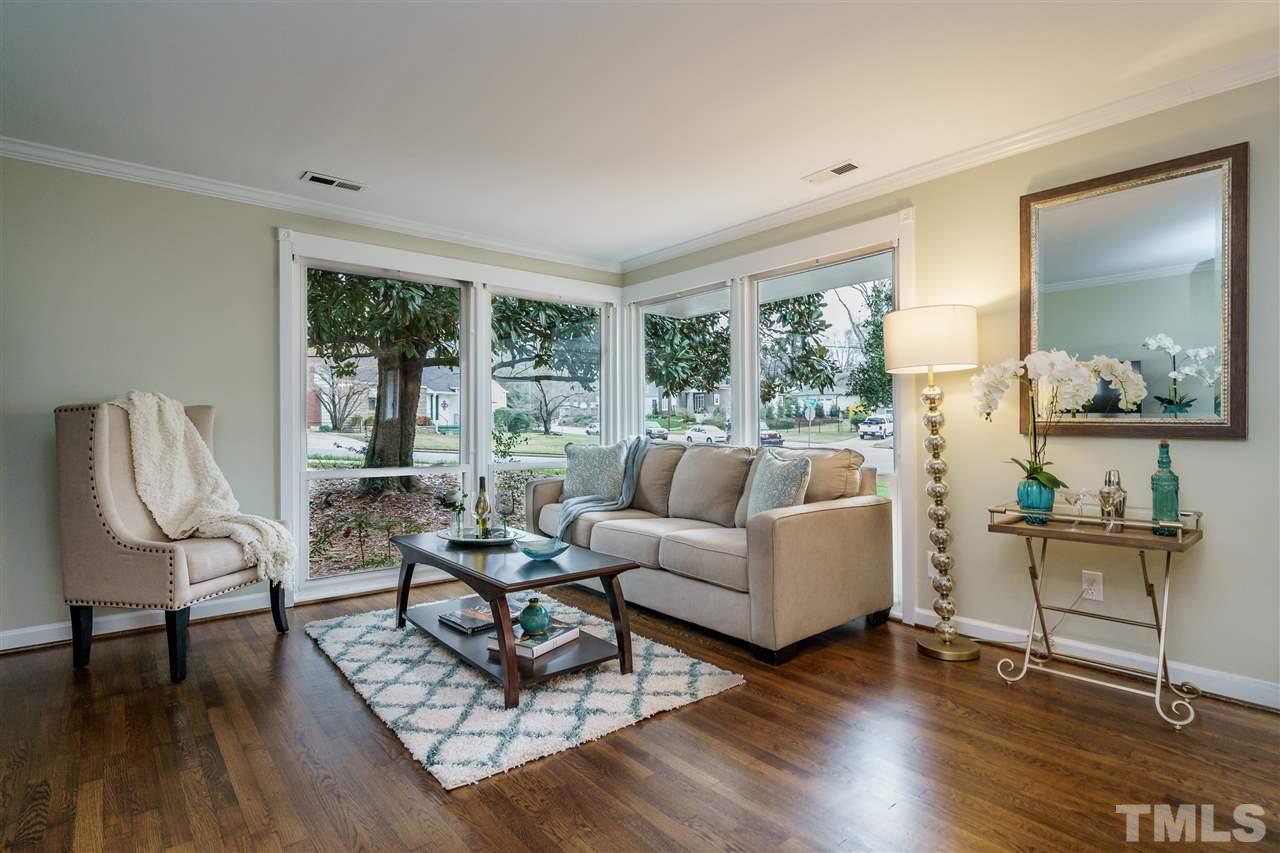 1707 Sutton Drive Raleigh, NC 27605 - Photo 3 of 29 a living room with furniture and a wooden floor