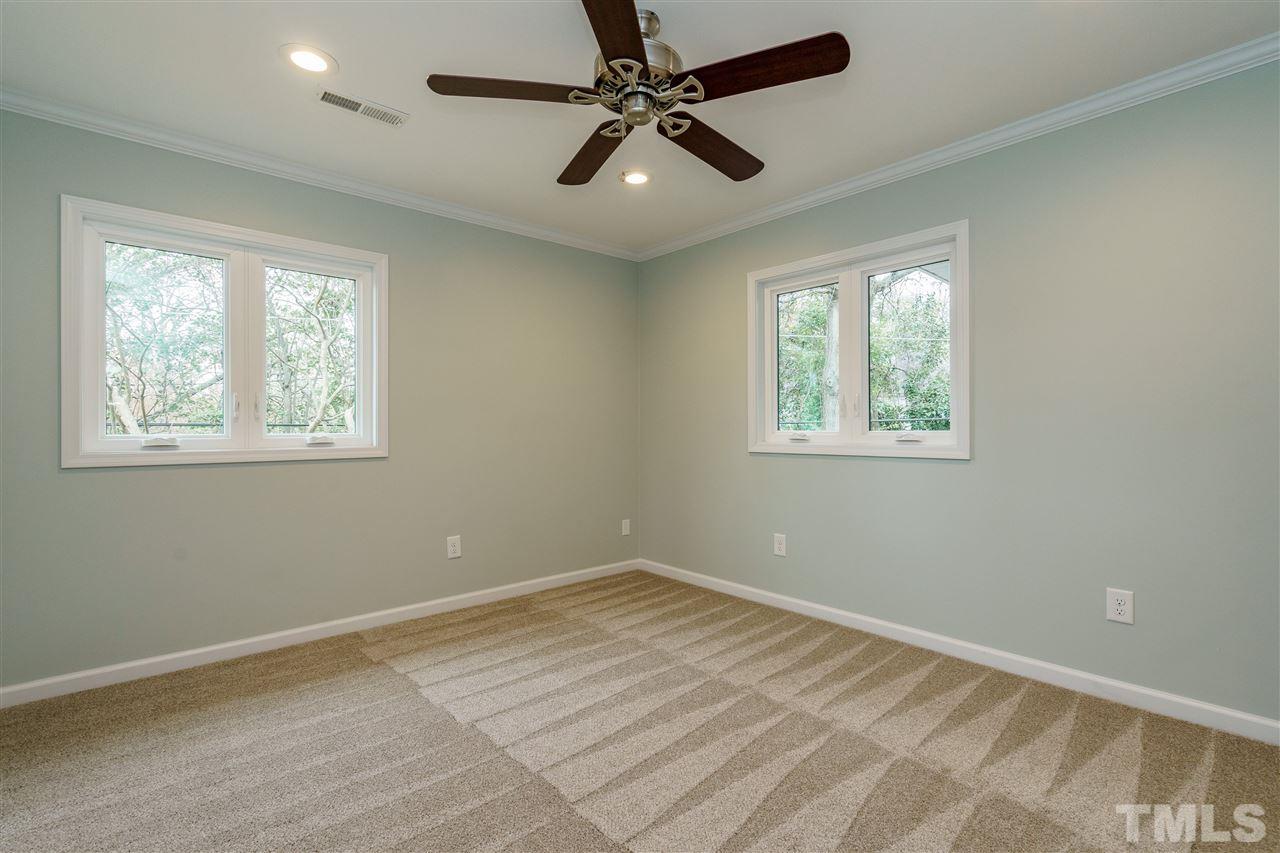 1707 Sutton Drive Raleigh, NC 27605 - Photo 23 of 29 a view of an empty room with a window