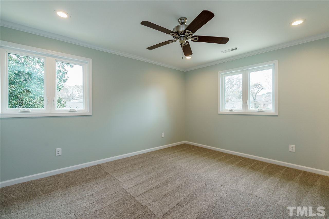 1707 Sutton Drive Raleigh, NC 27605 - Photo 24 of 29 an empty room with a window