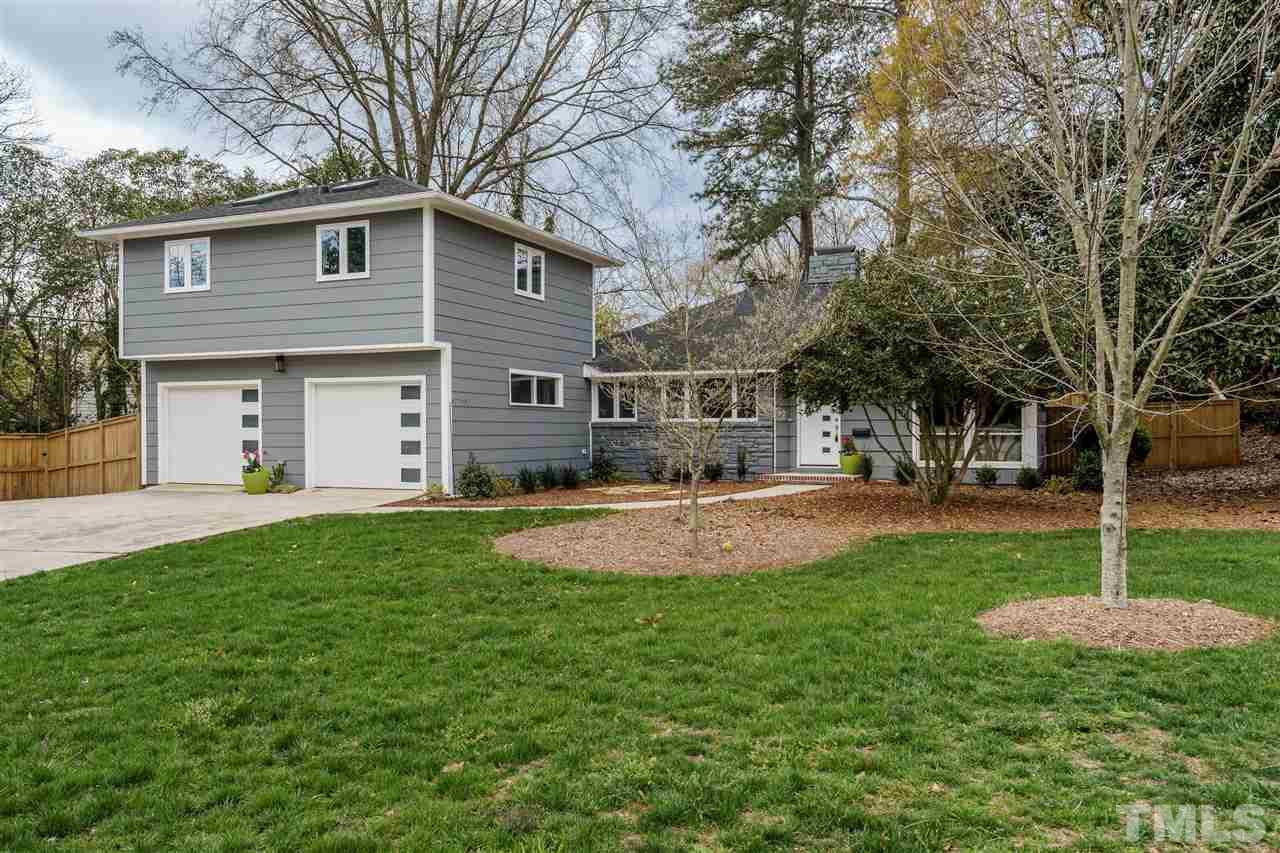 1707 Sutton Drive Raleigh, NC 27605 - Photo 29 of 29 a view of a house with pool and a yard