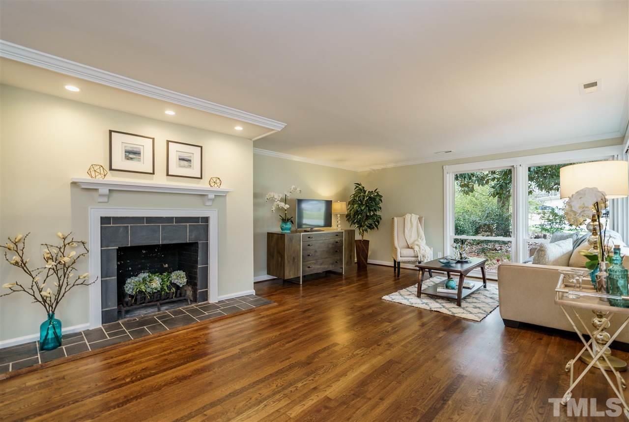 1707 Sutton Drive Raleigh, NC 27605 - Photo 7 of 29 a living room with furniture and a fireplace