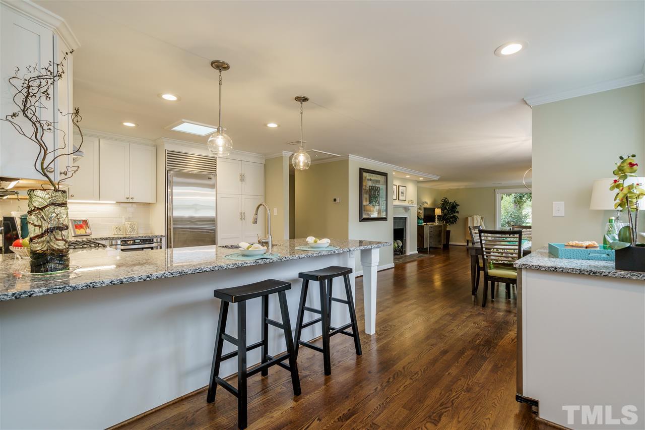 1707 Sutton Drive Raleigh, NC 27605 - Photo 9 of 29 a kitchen with lots of counter space and furniture
