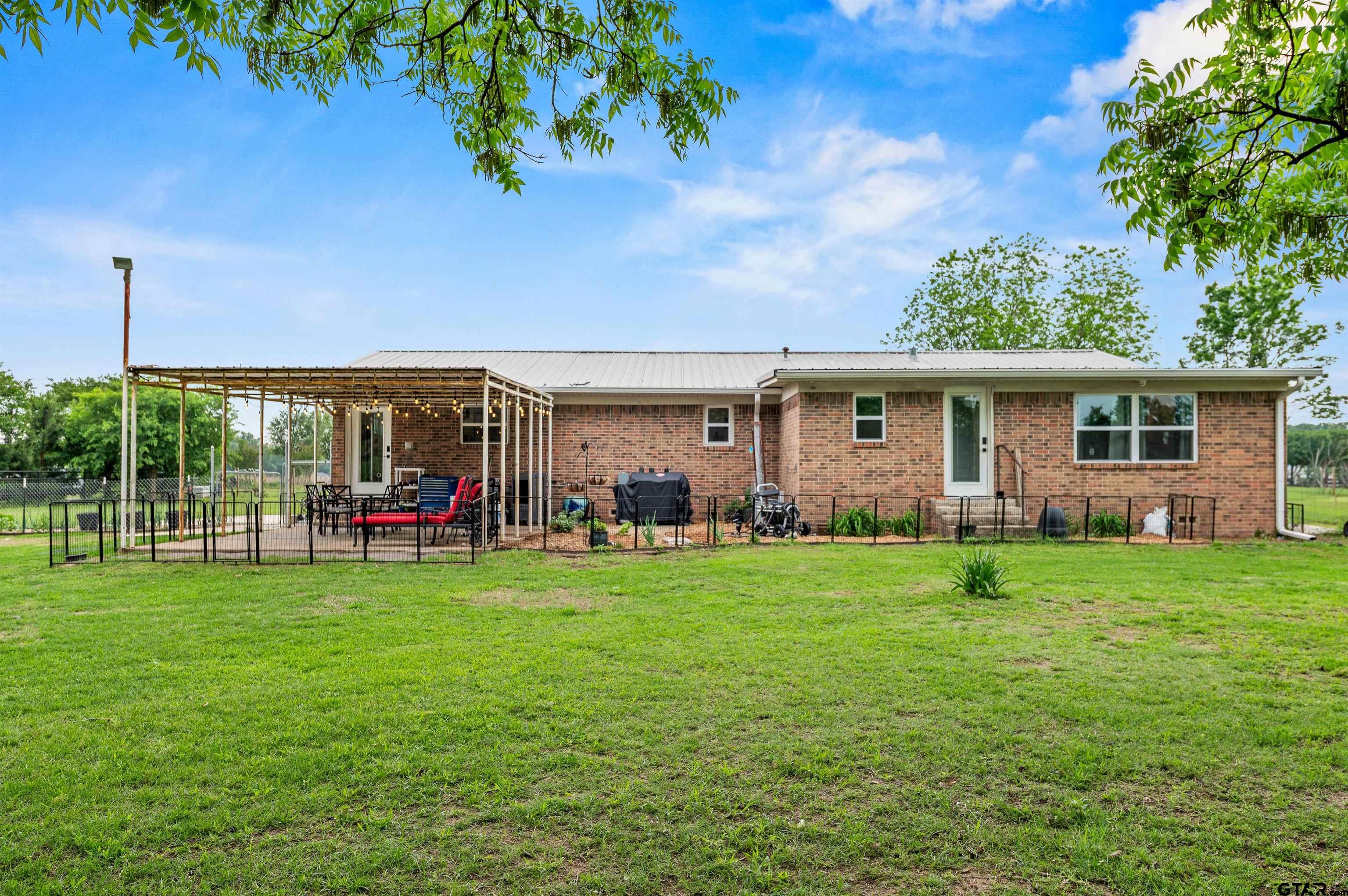 536 County Road 2373 Alba, TX 75410 - Photo 14 of 19 a view of a house with a yard and sitting area