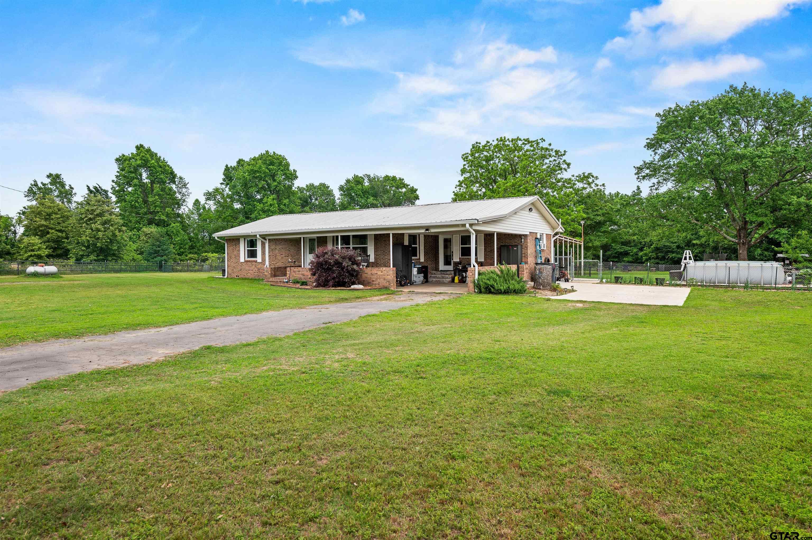 536 County Road 2373 Alba, TX 75410 - Photo 2 of 19 a view of a house with a big yard