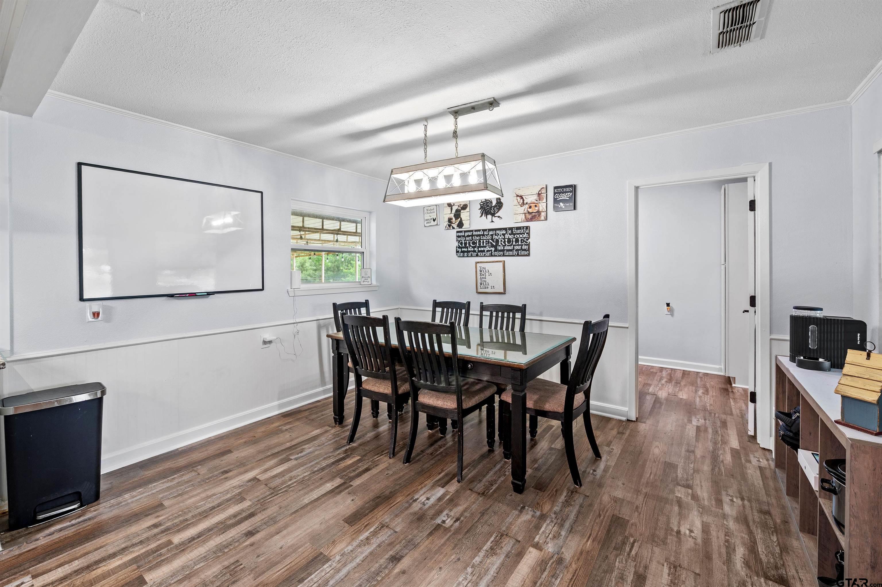 536 County Road 2373 Alba, TX 75410 - Photo 5 of 19 a dining room with furniture a chandelier and wooden floor