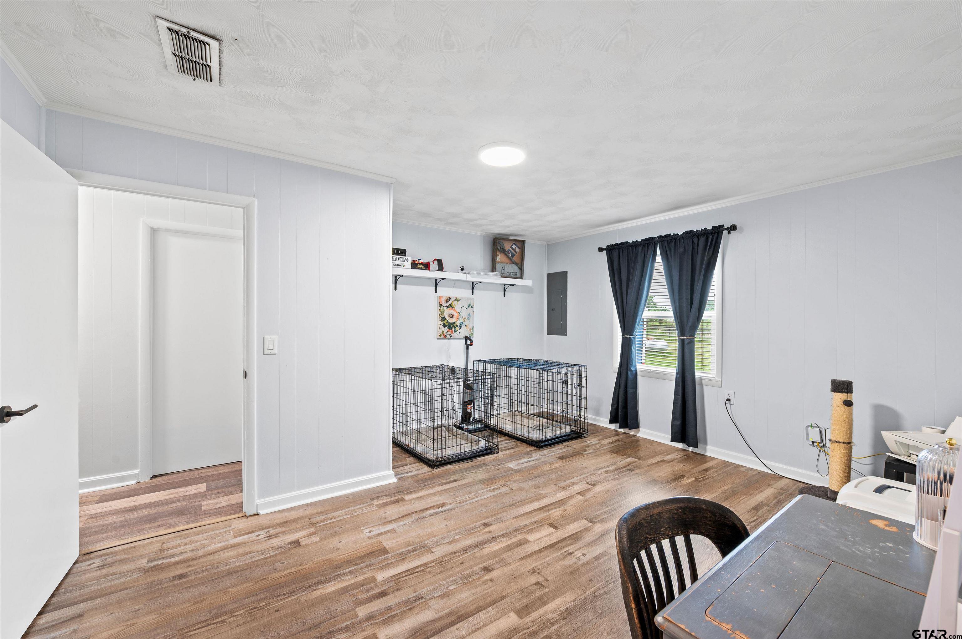 536 County Road 2373 Alba, TX 75410 - Photo 10 of 19 a bedroom with a bed and wooden floor