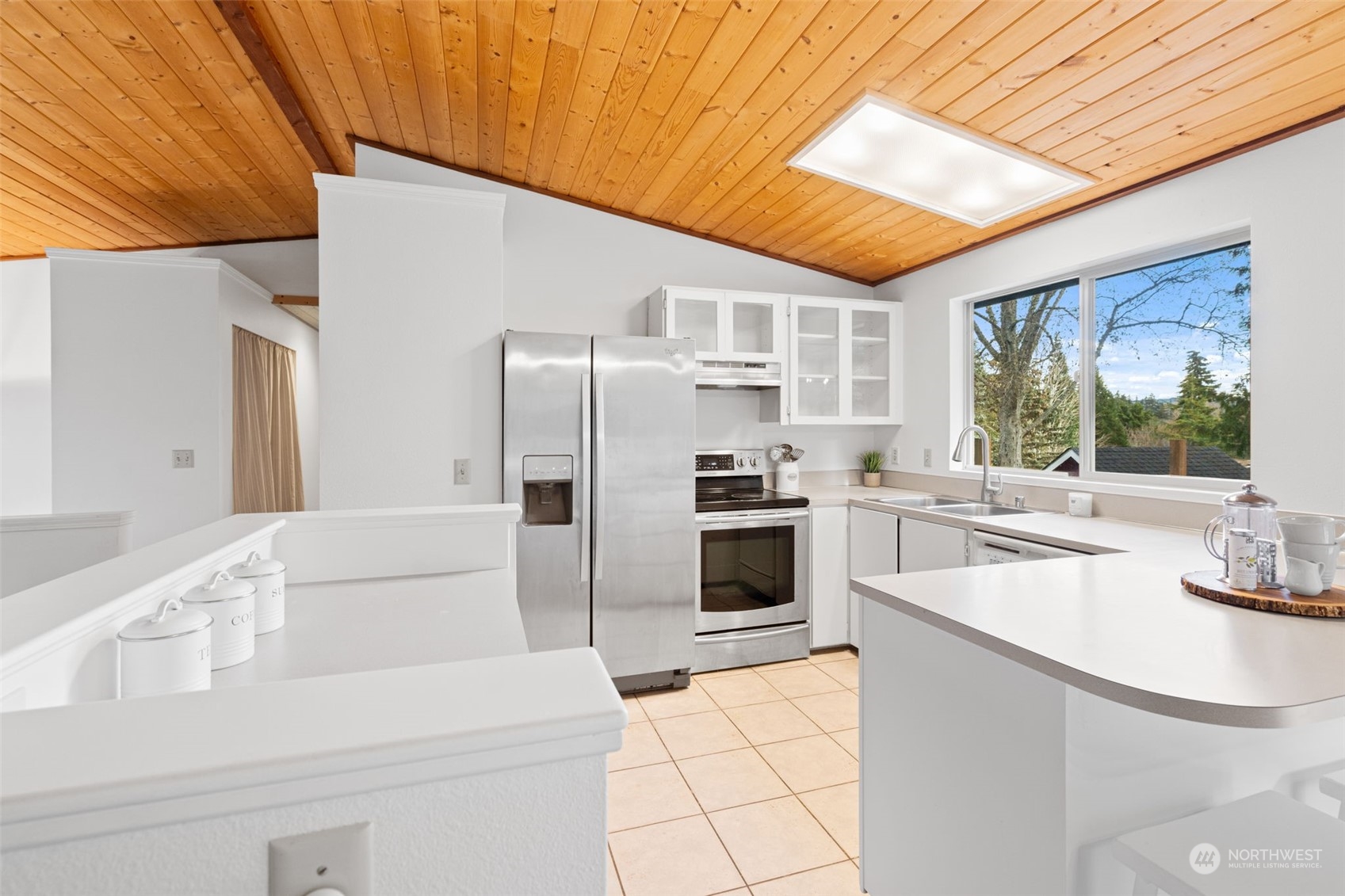 505 Cypress Road Bellingham, WA 98225 - Photo 9 of 37 a kitchen with white cabinets and stainless steel appliances