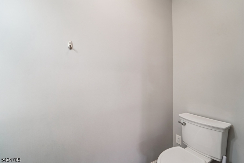 204 Harrison Street Nutley, NJ 07110 - Photo 12 of 23 a white toilet sitting next to a white wall