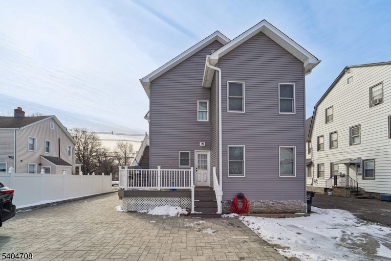 204 Harrison Street Nutley, NJ 07110 - Photo 21 of 23 a front view of a house with a yard