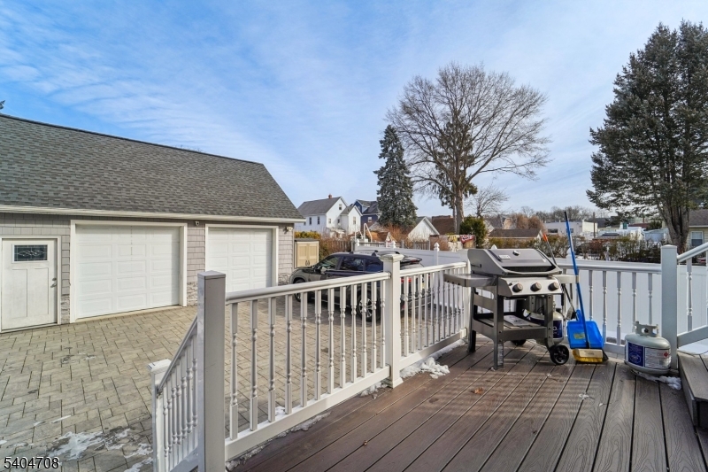 204 Harrison Street Nutley, NJ 07110 - Photo 22 of 23 a view of a house with wooden deck