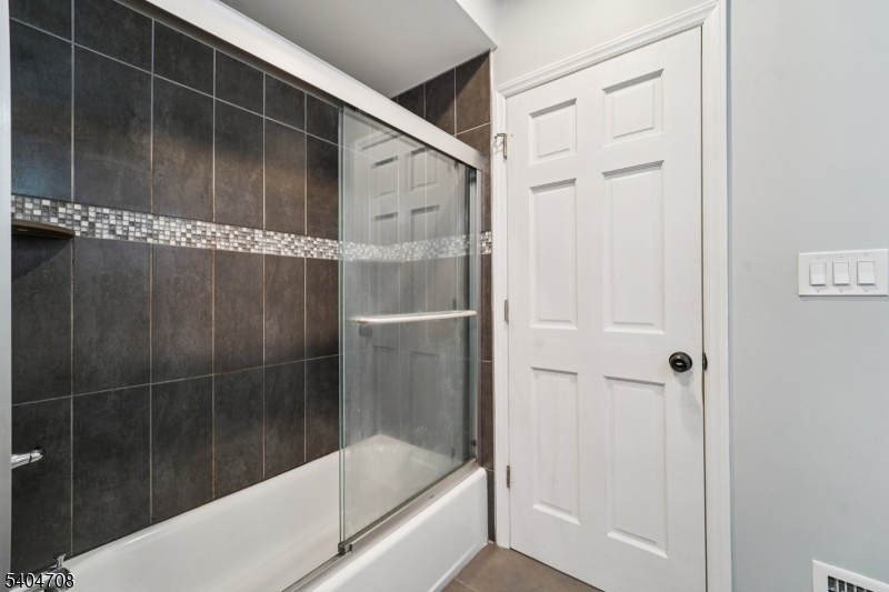 204 Harrison Street Nutley, NJ 07110 - Photo 5 of 23 a bathroom with a shower