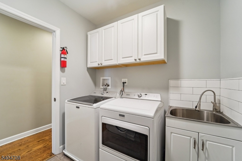 204 Harrison Street Nutley, NJ 07110 - Photo 9 of 23 a utility room with dryer and washer