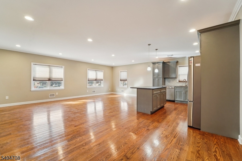 204 Harrison Street Nutley, NJ 07110 - Photo 10 of 23 a view of kitchen with cabinets and wooden floor