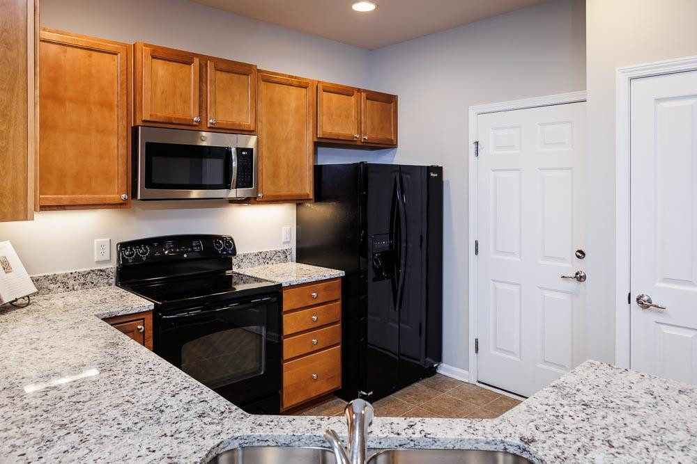 8714 Redcrest Place Raleigh, NC 27617 - Photo 8 of 29 Refrigerator Conveys