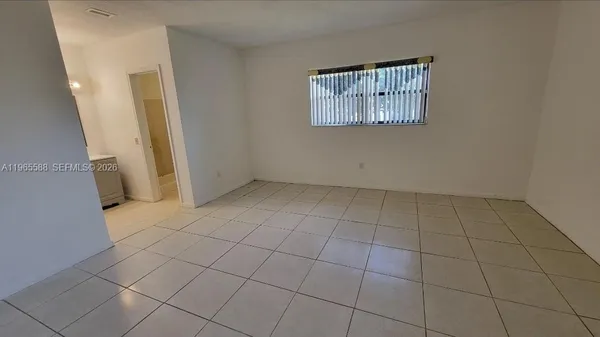 an empty room with a bathroom