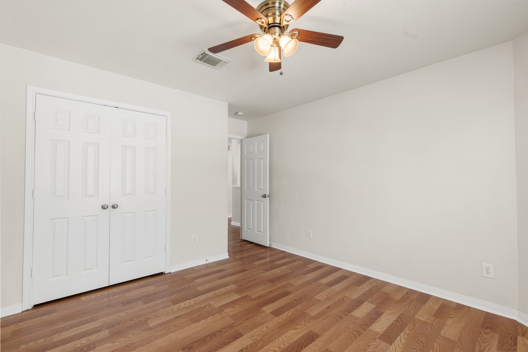 3111 Holly Ranch Drive Katy, TX 77494 - Photo 19 of 28 a view of an empty room with wooden floor