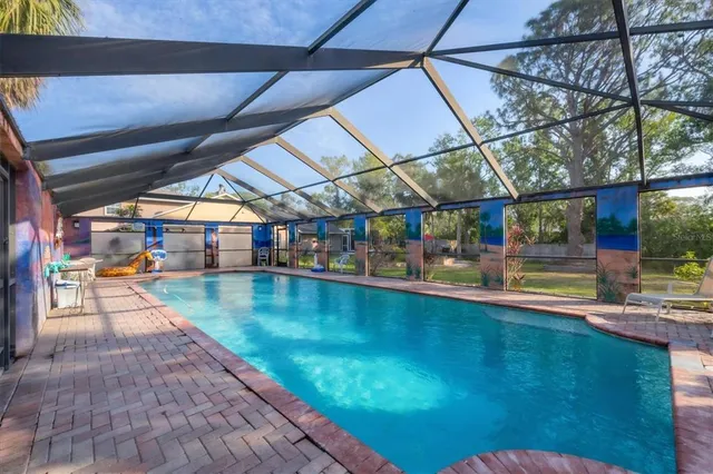 a view of a swimming pool with a patio