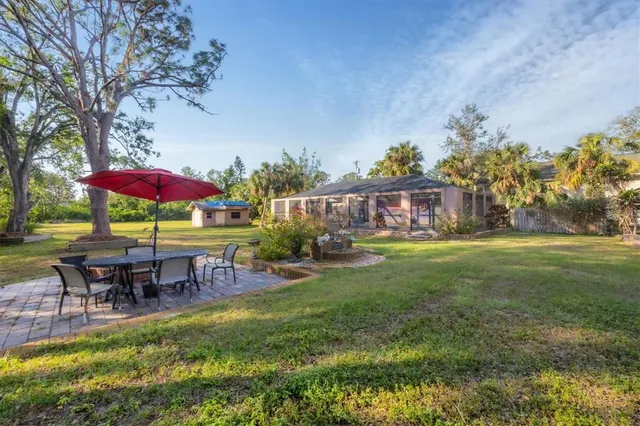 an outdoor space with furniture and umbrella