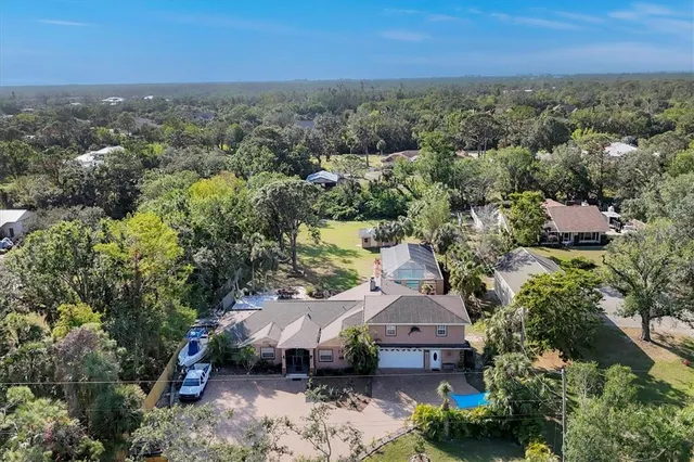 an aerial view of a house with a garden