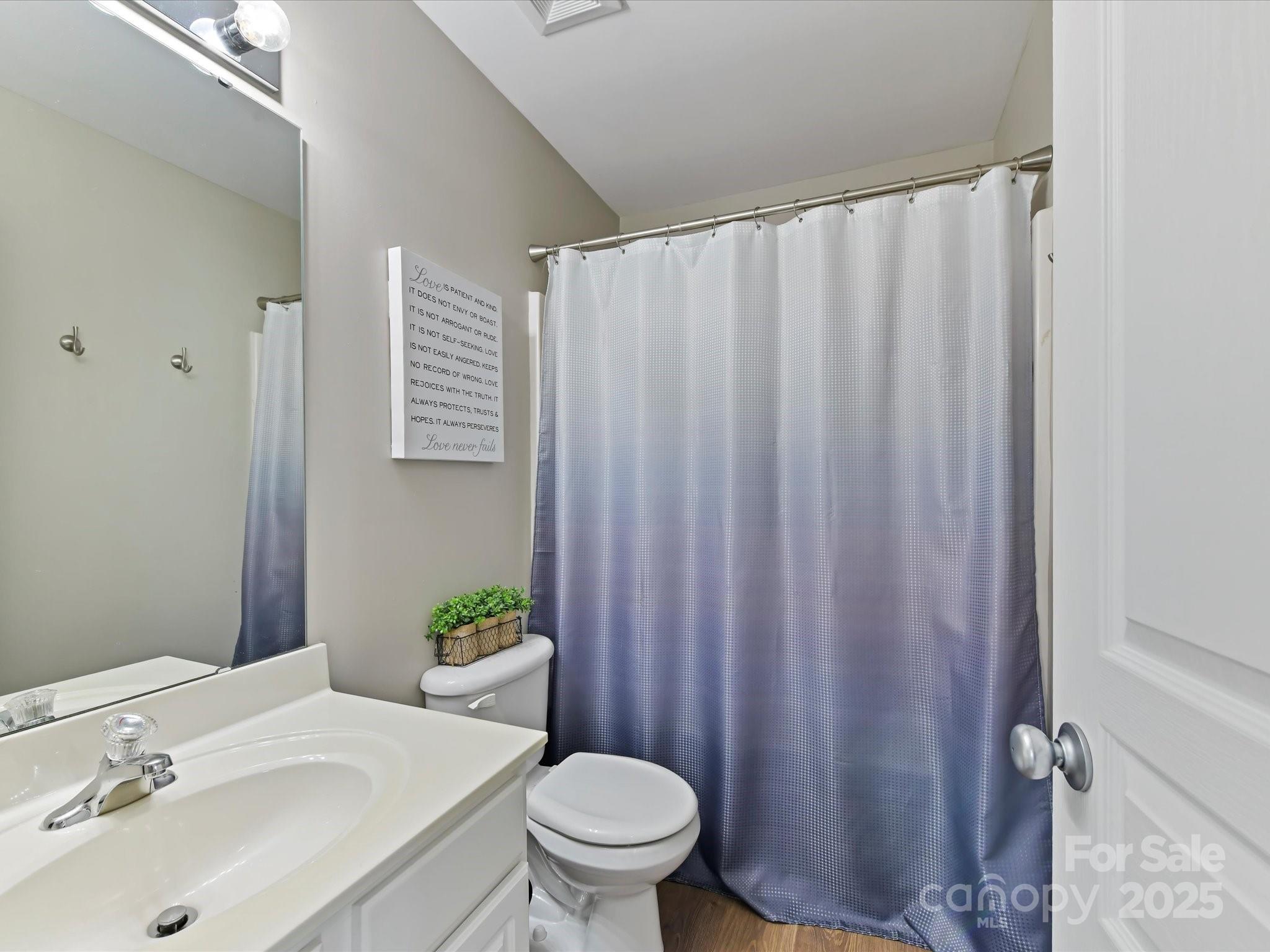 836 Gentlewinds Court Fort Mill, SC 29708 - Photo 23 of 29 a bathroom with a sink a toilet and a mirror