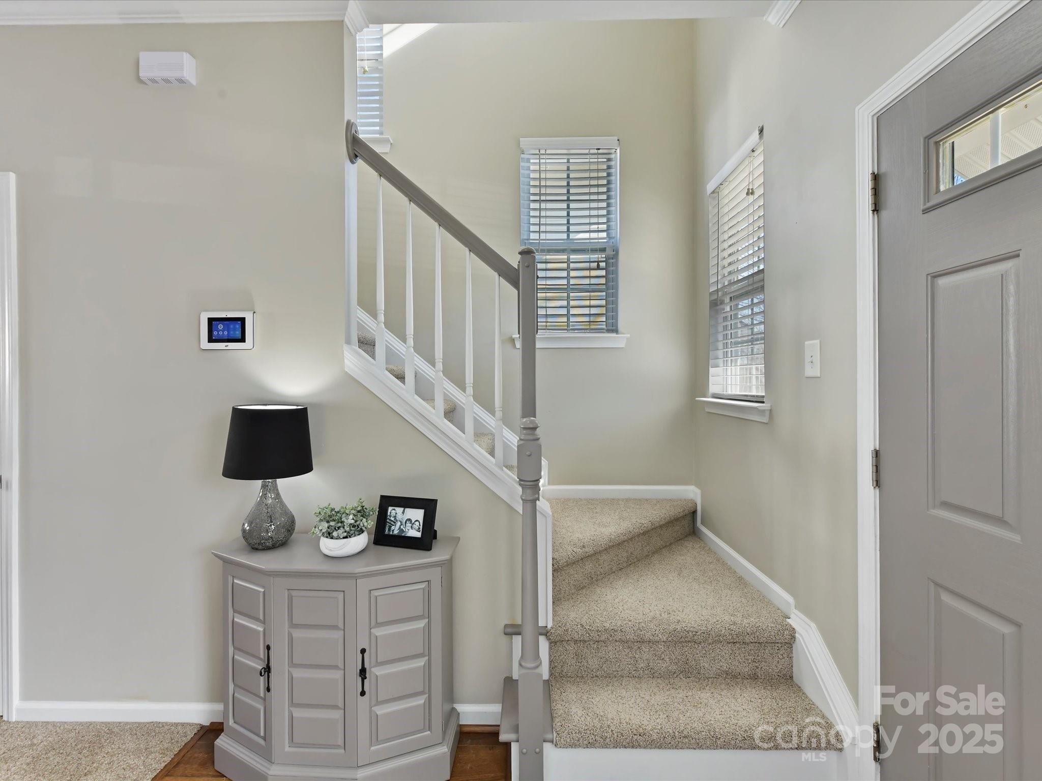 836 Gentlewinds Court Fort Mill, SC 29708 - Photo 3 of 29 a view of entryway and hall with a window