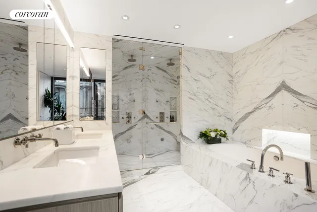 a bathroom with a tub and a shower