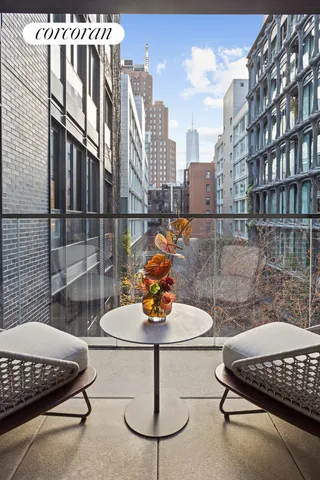 a view of a patio with a table and chairs and potted plants