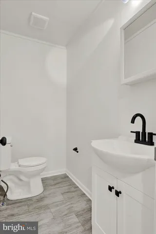 a bathroom with a sink and a toilet