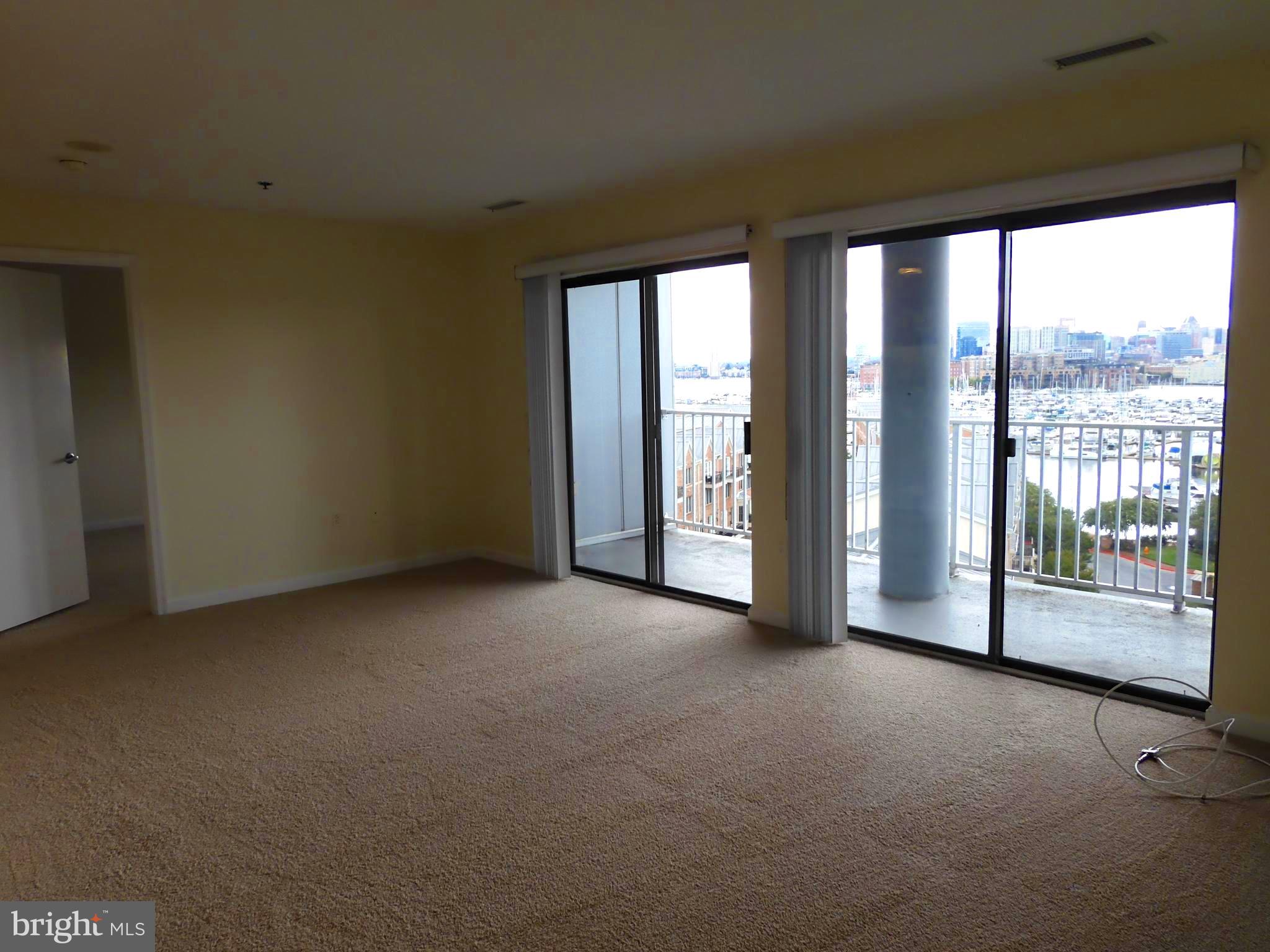 2702 Lighthouse Point East, Unit 612 Baltimore, MD 21224 - Photo 7 of 30 Living/Dining area