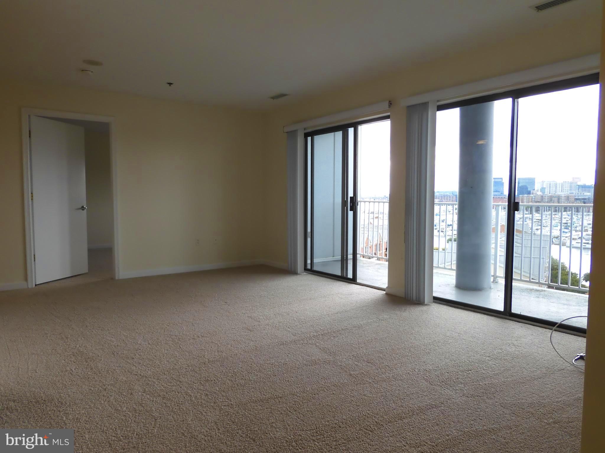 2702 Lighthouse Point East, Unit 612 Baltimore, MD 21224 - Photo 8 of 30 Living/Dining Area w/water view