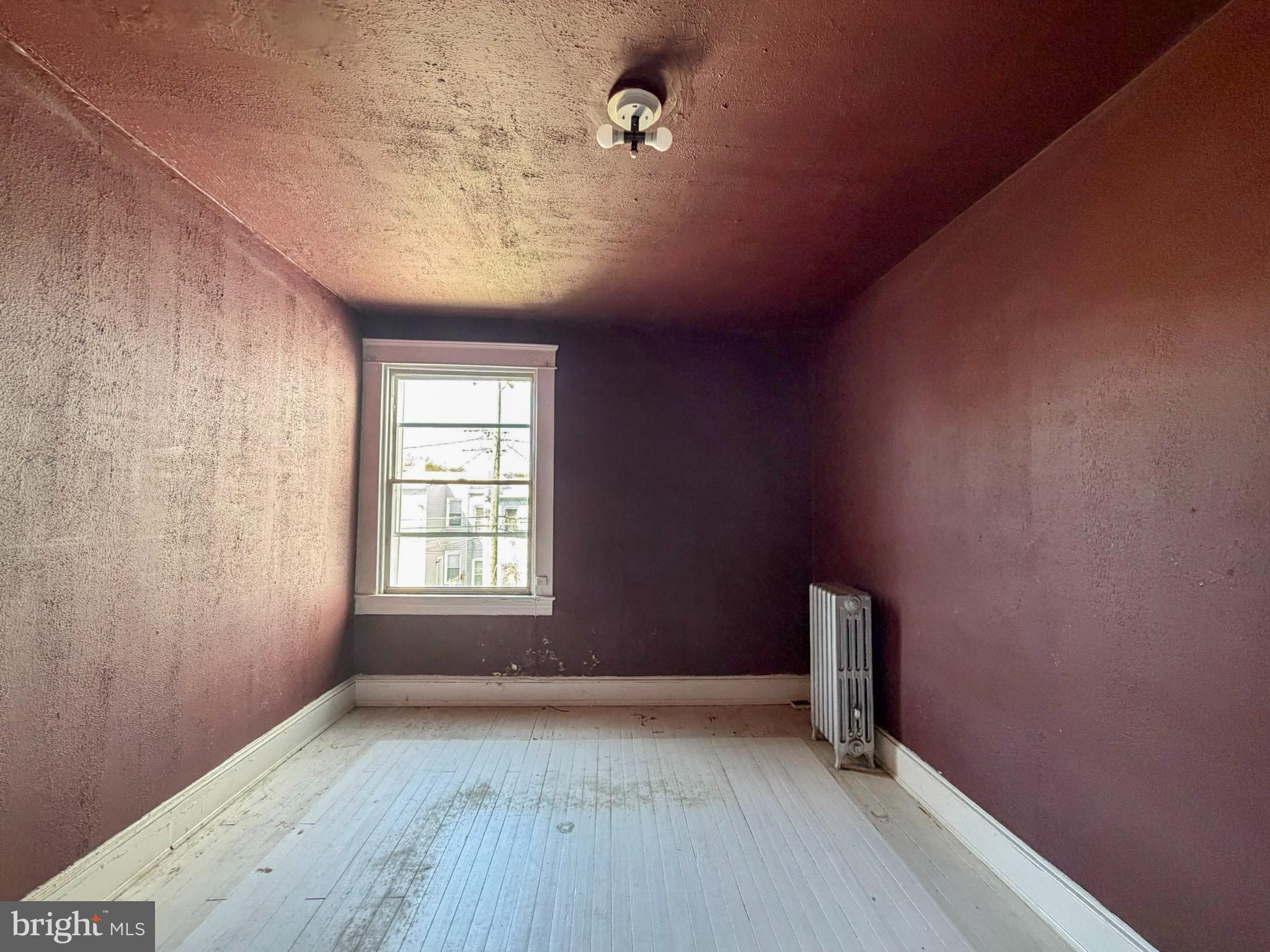 2802 Brighton Street Baltimore, MD 21216 - Photo 20 of 38 an empty room with windows