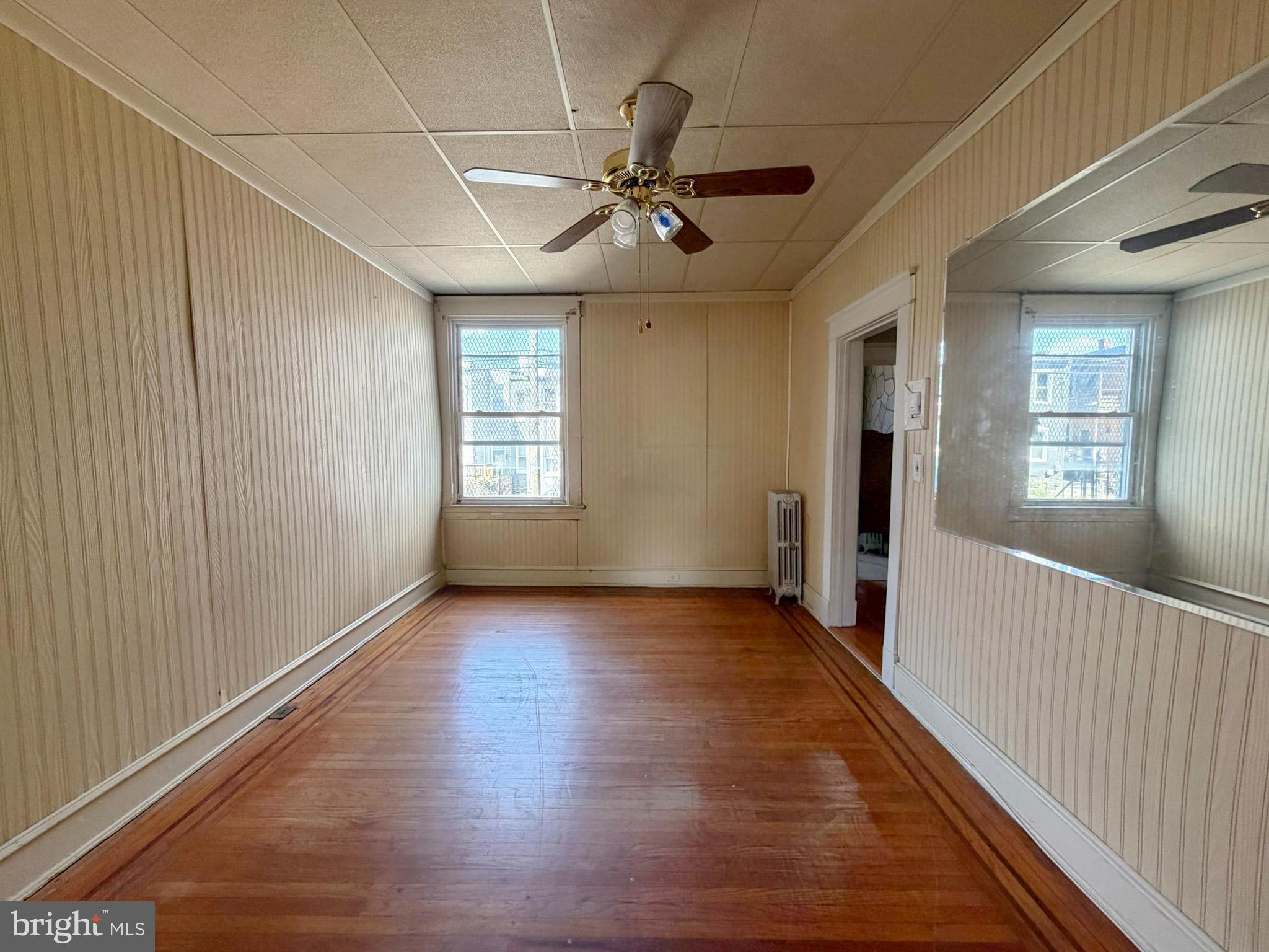 2802 Brighton Street Baltimore, MD 21216 - Photo 9 of 38 a view of an empty room with a window