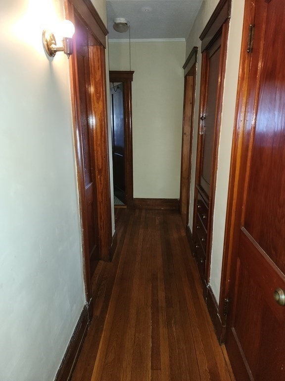 57 Austin Street, Unit 2 Boston, MA 02136 - Photo 5 of 17 a view of a room with wooden floor