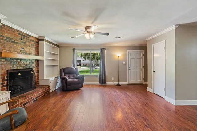 a kitchen with granite countertop stainless steel appliances a sink stove top oven and cabinets