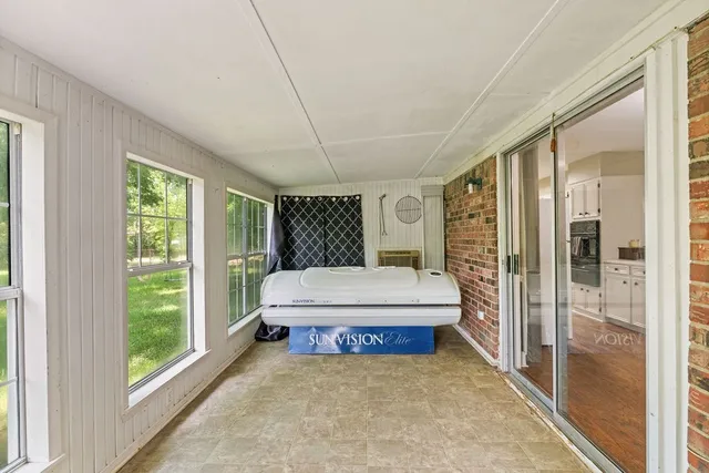 a huge green field with lots of trees