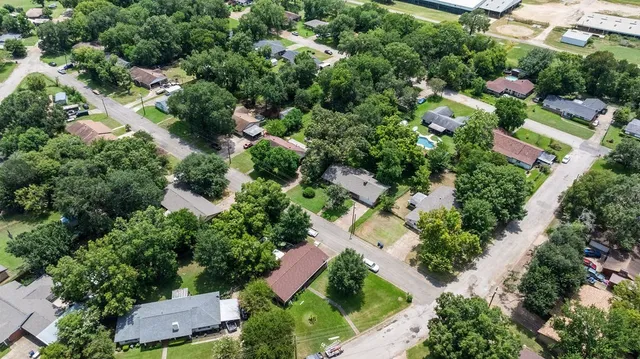 an aerial view of street and houses