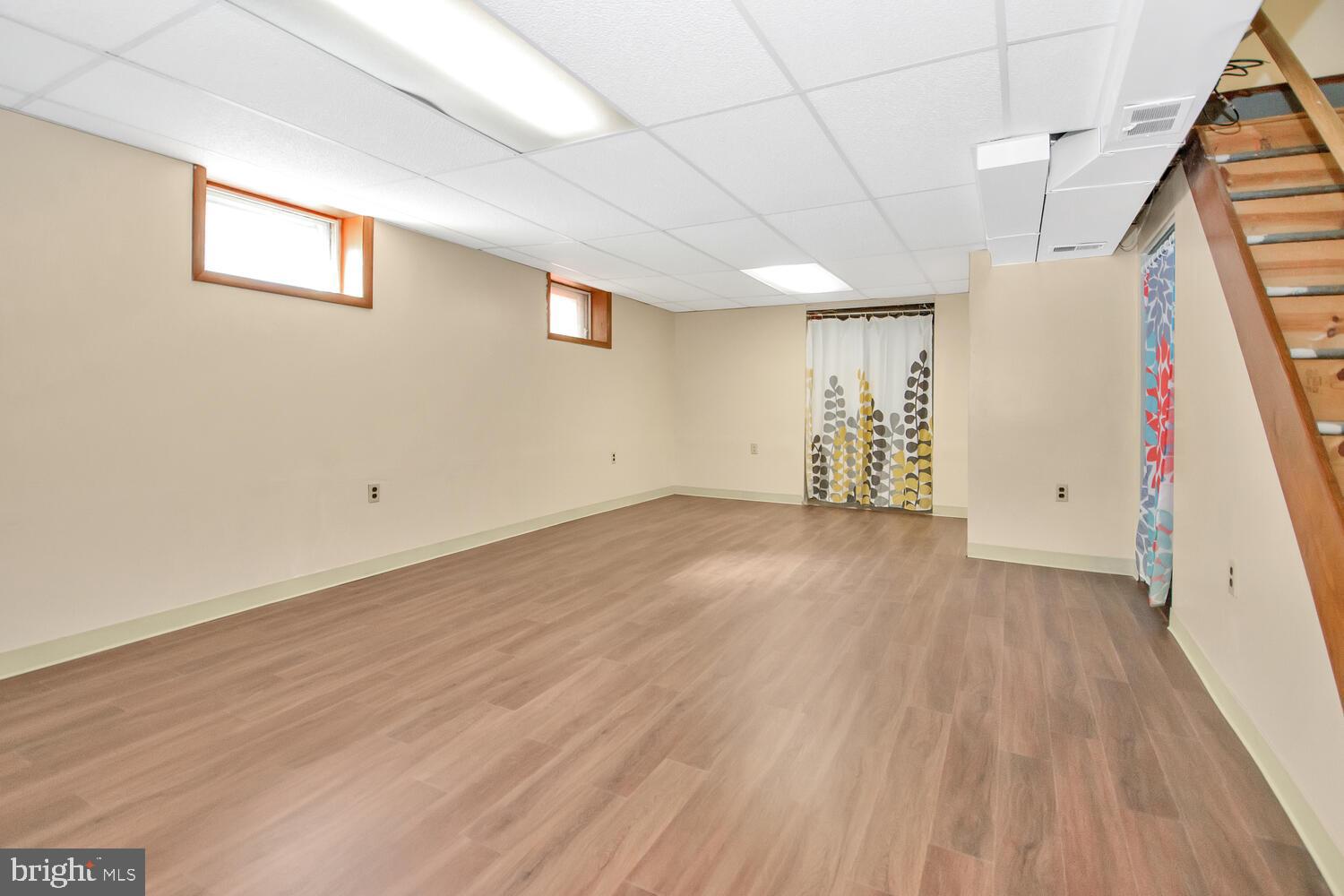 1466 Bluejay Road Abington, PA 19001 - Photo 18 of 20 an empty room with wooden floor and white walls