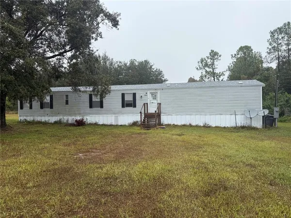 a front view of a house with swimming pool
