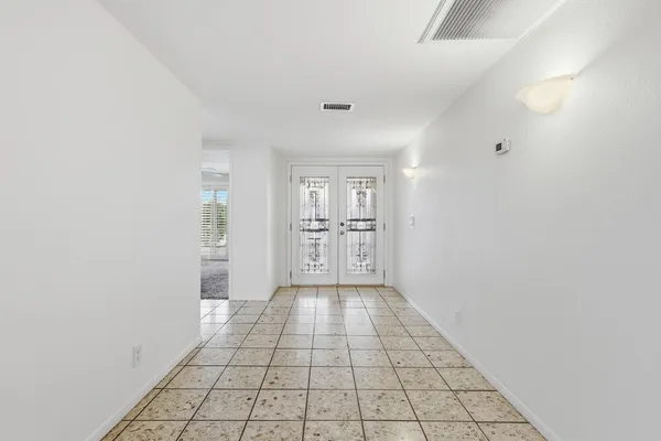 a view of an empty room and window