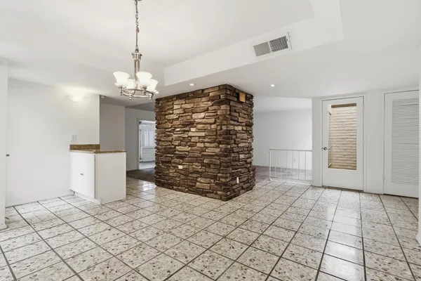 a view of empty room with windows